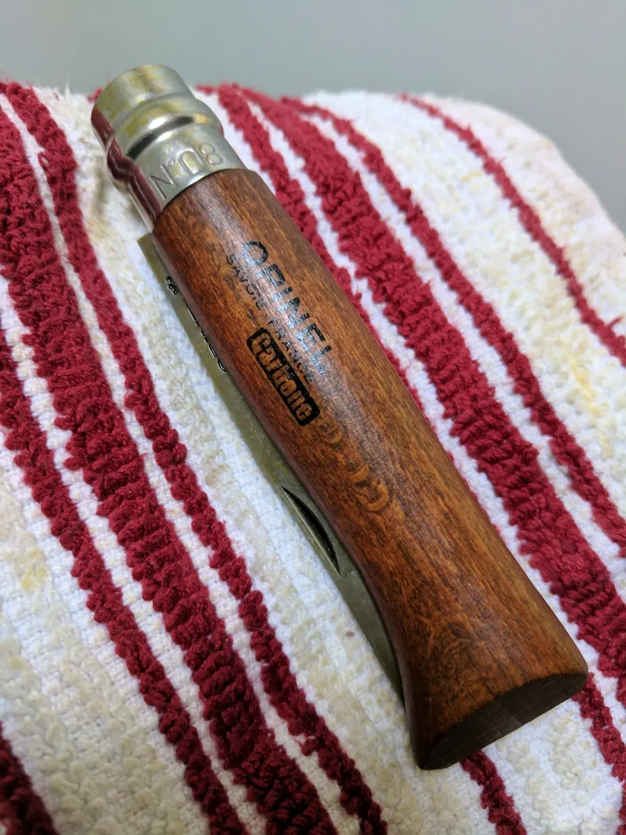 Opinel No.8 handle after oil sealing, darkened like walnut