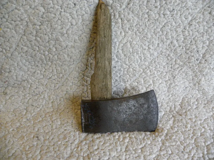 Sater Banko hatchet head with the old broken handle still lodged in the eye